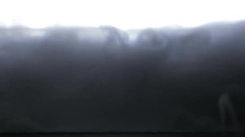 Abstract Smoke Swirls Against a Bright Background