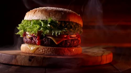 Close-Up of Delicious Hamburger on Wooden Board
