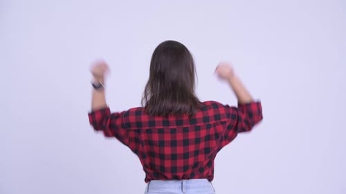 Rear View of Happy Young Hipster Woman with Fists Raised