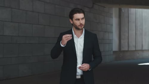 Business Man Opening Box with Earbuds on Street, Manager Putting on Earphones