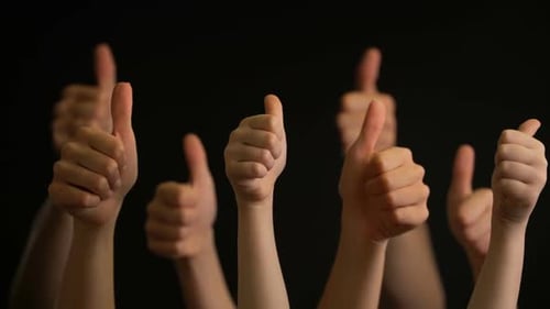 Many Arms Give Thumbs Up Sign on Black