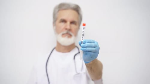 Doctor Holding COVID-19 Test Making Stop Gesture