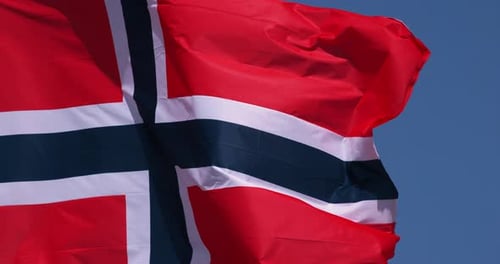 Flag Waving Against Blue Sky