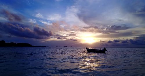 Daytime aerial tourism shot of a white sand paradise beach and blue ocean background in high resolution