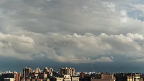 clouds over the modern city, a large-scale view, a grandiose sky, a storm approaching the city