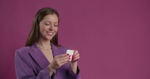 Young Woman Opening Wireless Earbuds Case