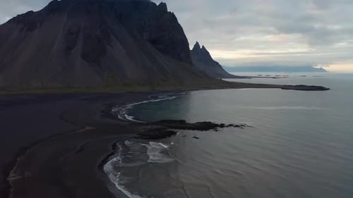 Drone Above Black Sand Beach With Vestrahorn Mountain