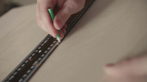 Carpenter Makes Pencil Markings on the Blank with the Help of a Ruler