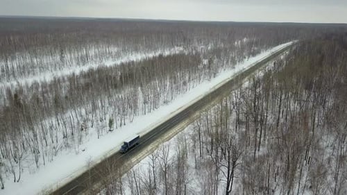 A Truck On A Winter Country Forest Road