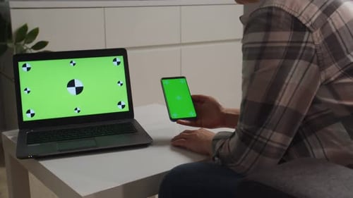 Side Moving of Camera Woman Holding Phone with Chromakey Green Screen