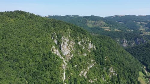 Flying Above Limestone Cliffs and Deciduous Forest. Aerial View