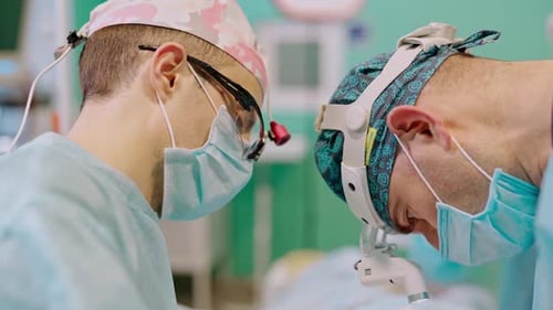 Medical team doing critical operation. Group of surgeons doing surgery in hospital operating theater
