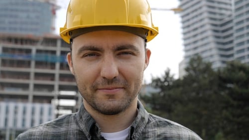 Young Businessman Construction Site Engineer Looking to Camera.