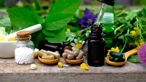 Alternative Medicine With Eye Dropper and Pills