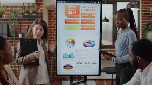 Colleagues Meeting to Review Business Analytics