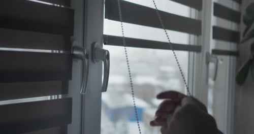 Man Installing Cassette Roller Blinds on Windows