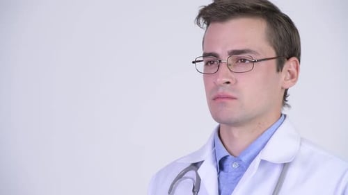 Smiling Young Doctor in White Coat Close Up