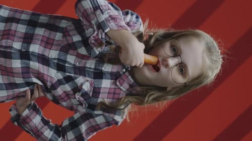 Girl Singing into Carrot Microphone, Vertical Clip