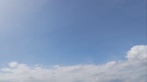 Time lapse of white cloud moving pass around sky background