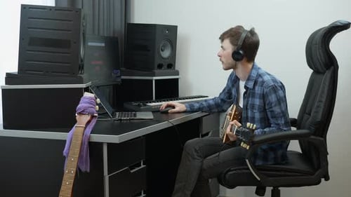 Sound engineer mixing and mastering pop rock song at home music recording studio