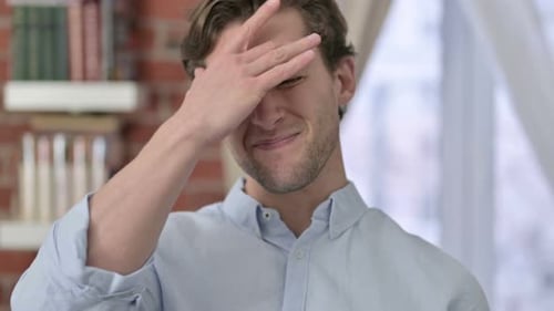 Young Adult Man Rubbing Forehead, Headache