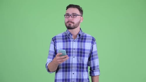 Man with Glasses Using Phone on Green Screen