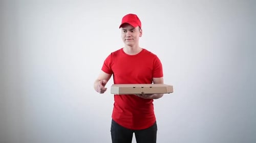 The Doorbell Rings. Pizza Delivery To the Customer. A Handsome Young Man.