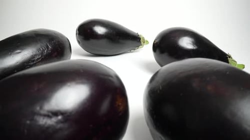 Fresh Eggplants on a White Background