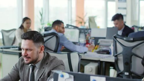 Middle-aged Caucasian Man Working in Office
