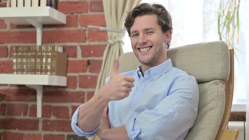 Attractive Man Smiling and Giving Thumbs Up