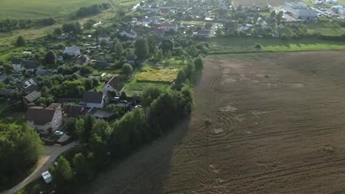 A small village surrounded by agricultural fields.