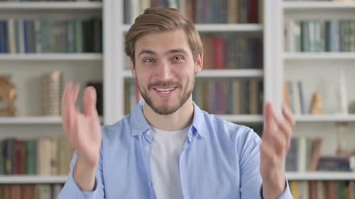 Smiling Man Talking to Camera in Online Meeting