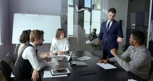 Business Team Professional Managers Sitting in Office Conference Meeting Listening To Leader Report
