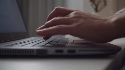 Woman Typing on Laptop Keyboard Close Up