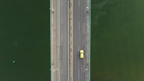 Aerial View of a Bridge Over a Large River with Heavy Traffic