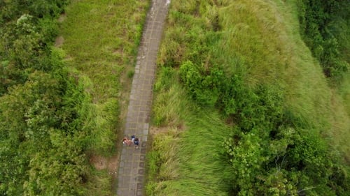 Aerial Shot of a Family Walking on the Artists Walk - Campuhan Ridge Walk in the Ubud Village on the