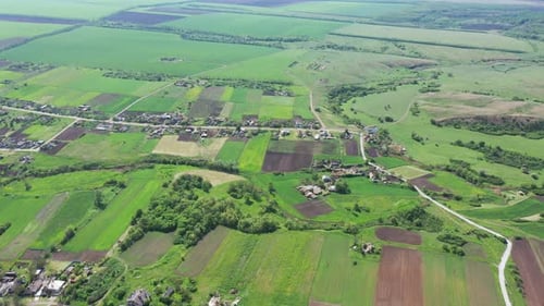 Aerial View of Green Fields and Rural Village