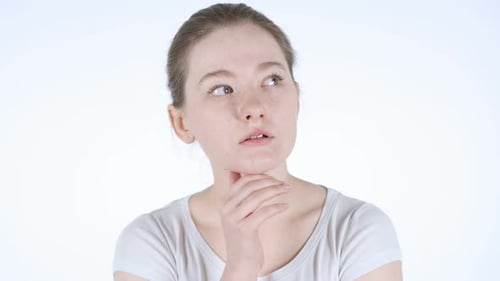 Young Woman Pondering with Hand on Chin
