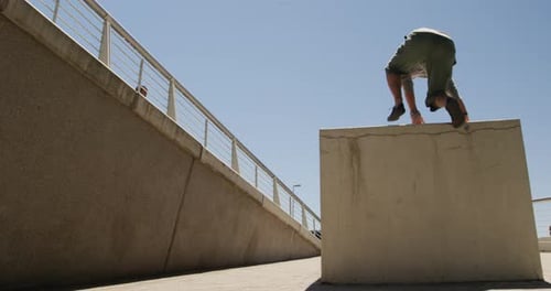Men Perform Parkour Moves on Urban Course