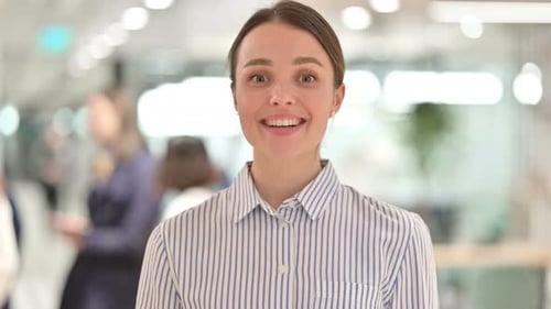 Smiling Woman in an Office Setting