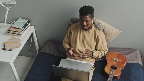 Young Adult Video Call on Laptop