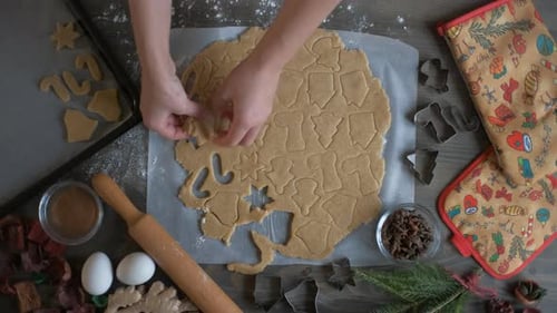 Hands Baking Christmas Gingerbread Cookies At Home