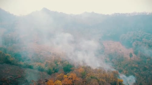 Aerial View of Smoke in Mountainous Environment