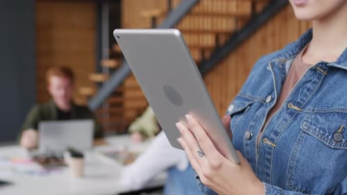 Hands of Young Businesswoman with Tablet