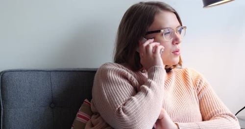 Woman Talking on Mobile Phone Indoors