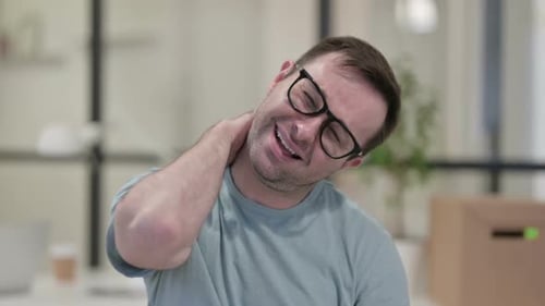 Adult Massaging Neck in Office Close Up