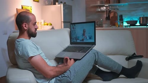Man Video Chatting with a Doctor on Laptop