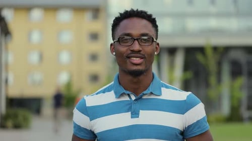 Portrait African American Young Man in Glasses Standing on Street Look at Camera