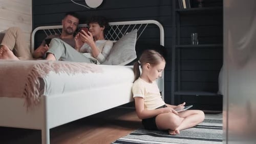 Family Relaxing at Home with Technology