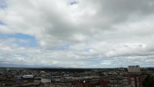 Clouds Moving on Sky Over Town